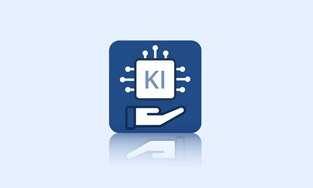 **Description concise et accessible de l'image:** Une icône bleue montre une micropuce avec l'inscription « IA », entourée de lignes de connexion. En dessous, une main stylisée tient la puce – symbole de l'intelligence artificielle d'assistance.